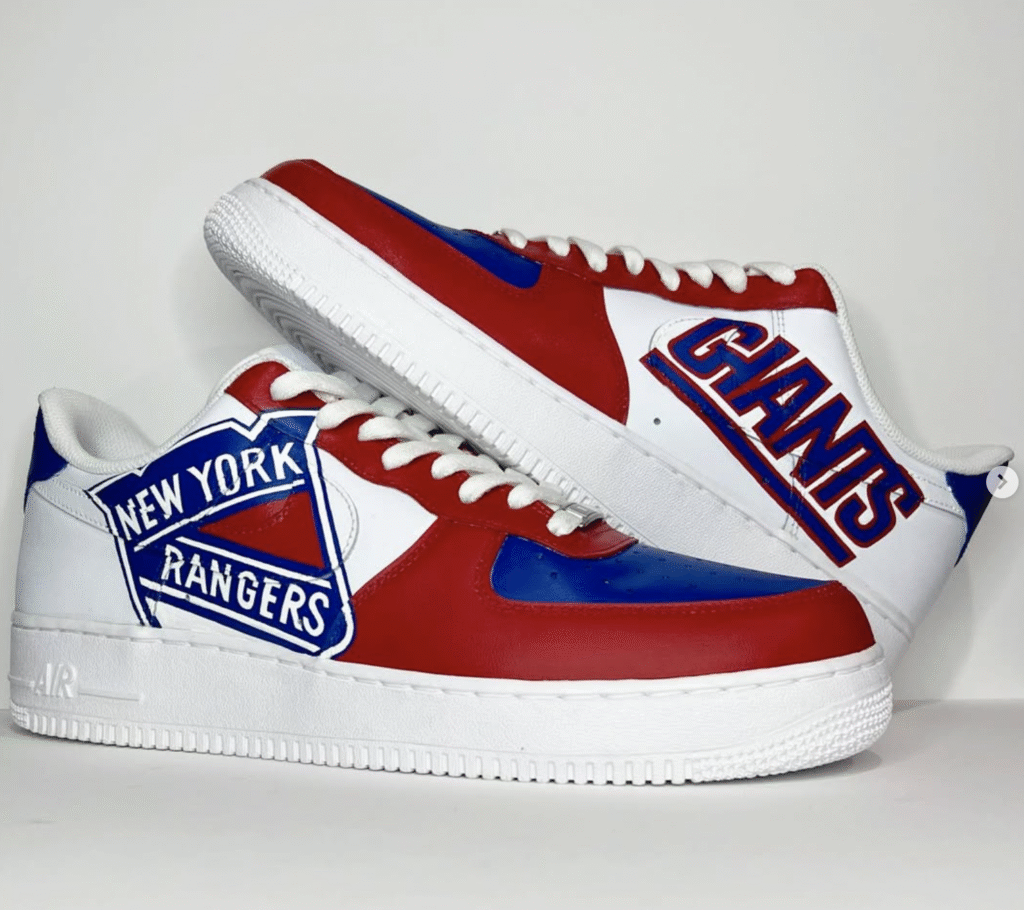 “Busy sneaker customization studio with artists painting Air Force 1s, shelves filled with finished custom sneakers, and laptop showing online orders, representing the global custom sneaker business.”